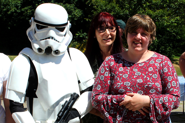 Support Worker with lady supported through autism west midlands and person dressed up in Starwars costume